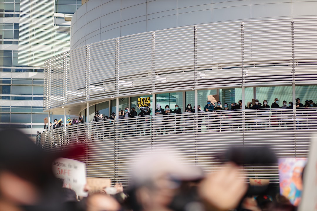 people walking on gray concrete pavement during daytime