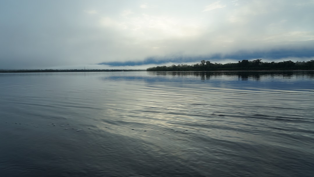 a body of water with land in the distance