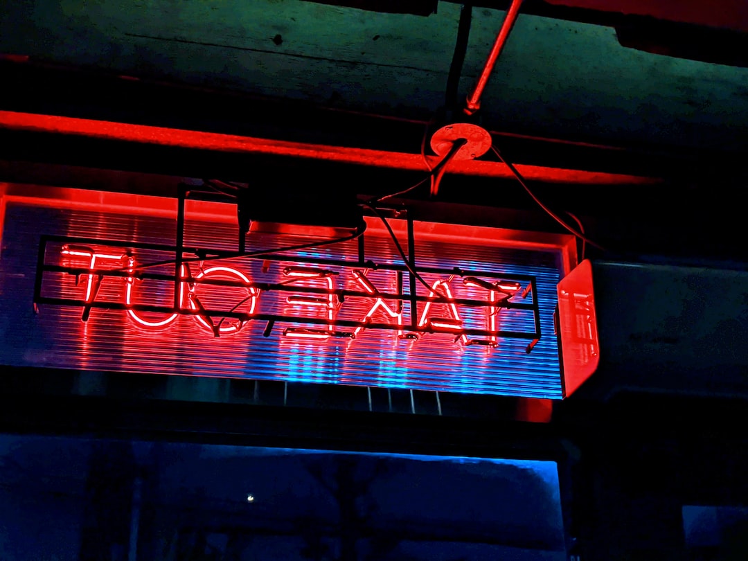 red and white neon light signage