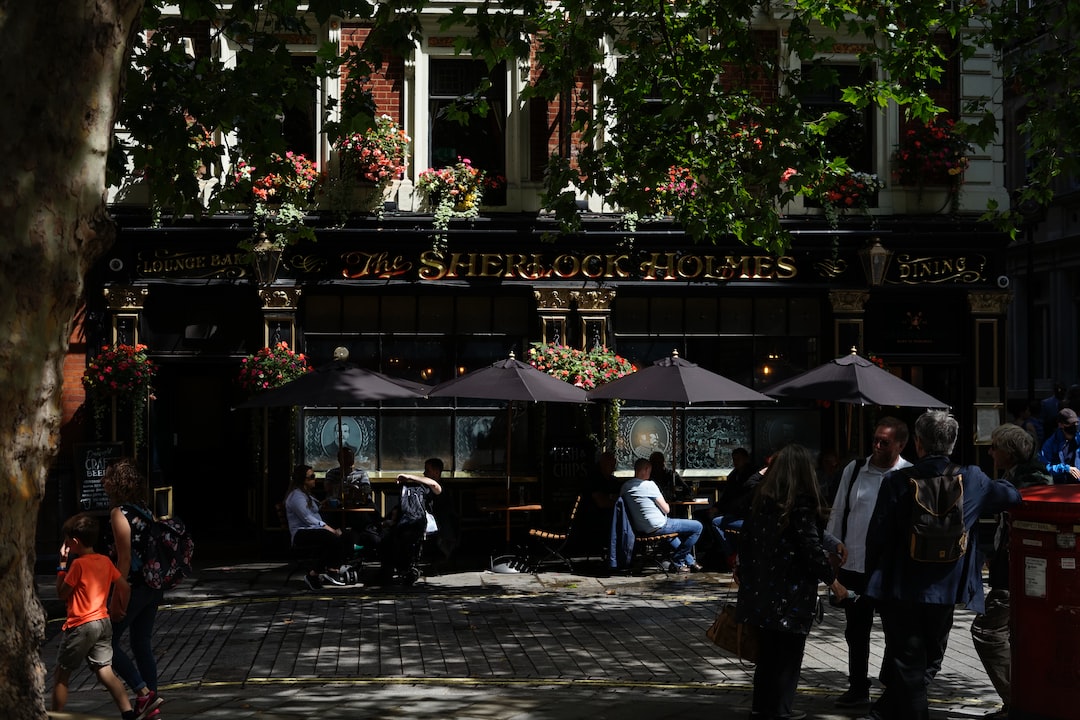 a group of people standing outside of a restaurant