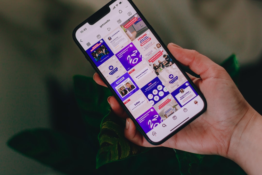 a person holding a cell phone in their hand