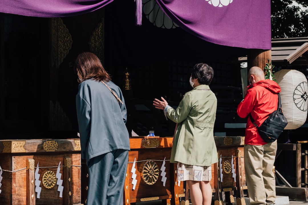woman in white long sleeve shirt standing beside man in gray long sleeve shirt
