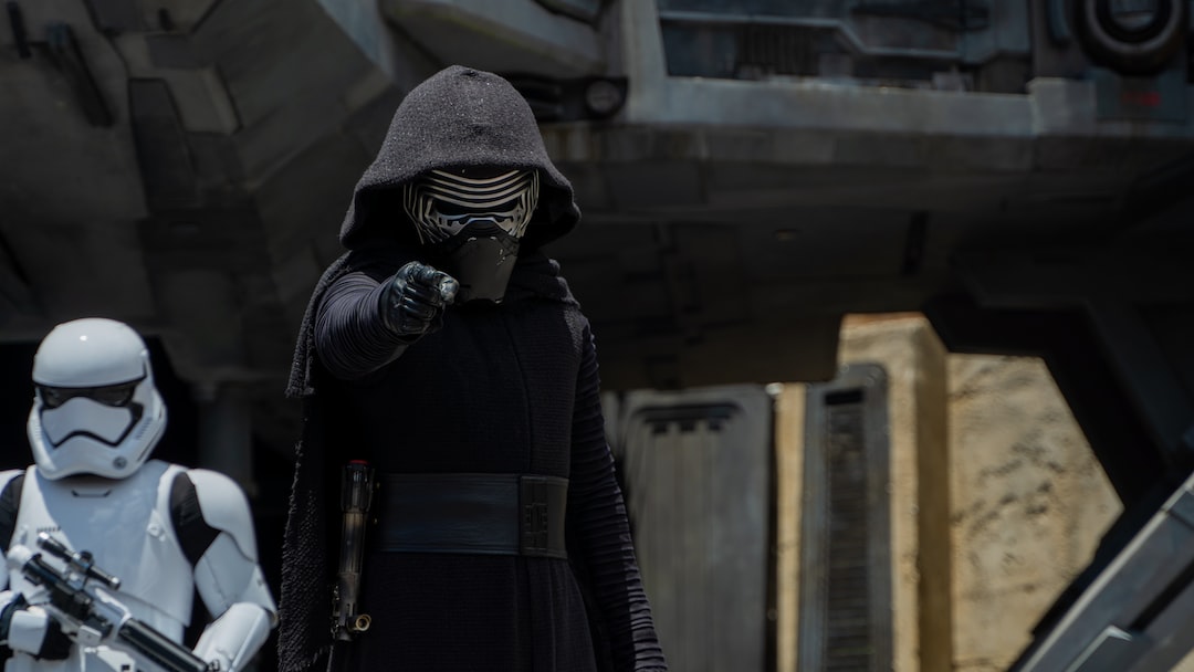 a man dressed as darth vader and a storm trooper