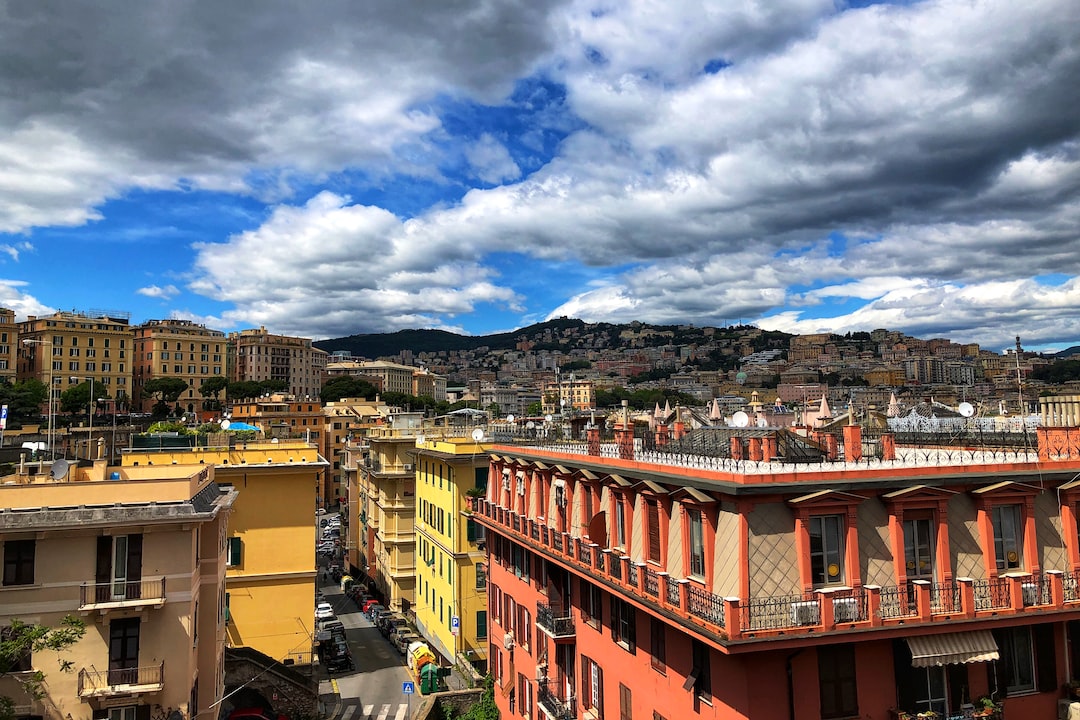 a view of a city with buildings and clouds