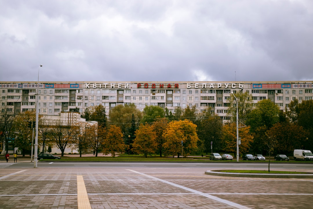 white concrete building near green trees during daytime