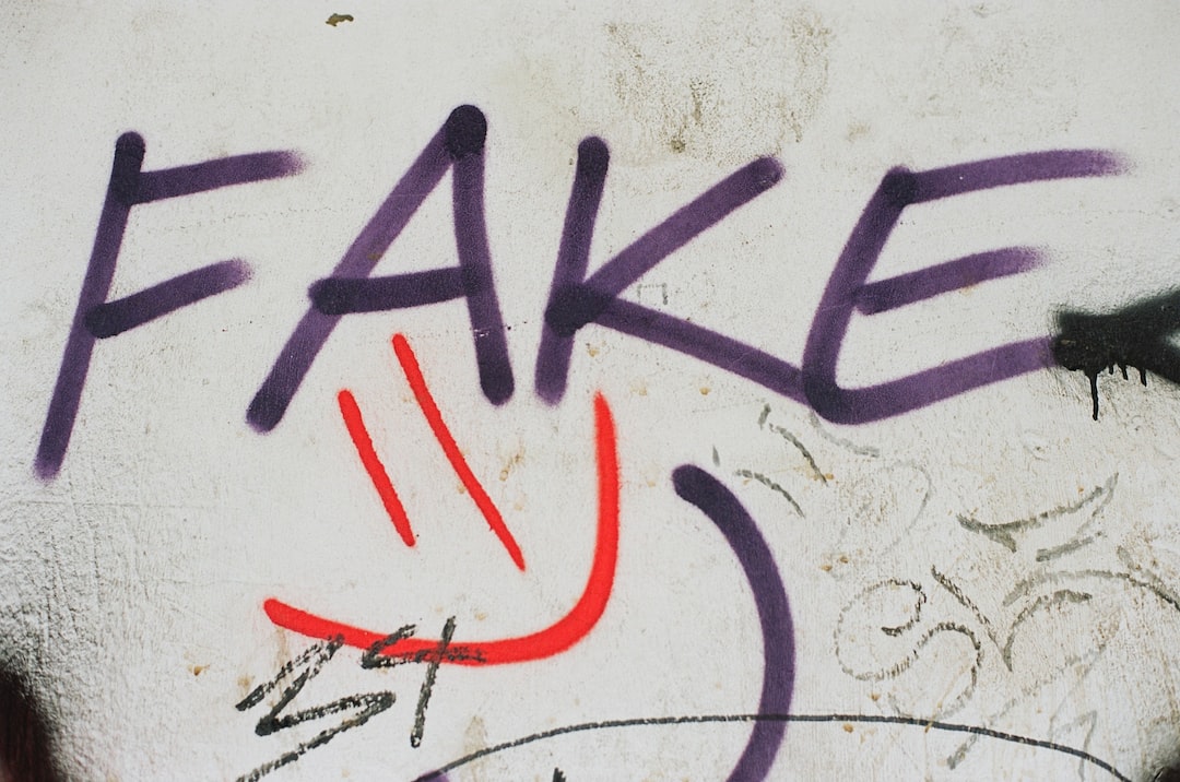 graffiti on a wall that says fake