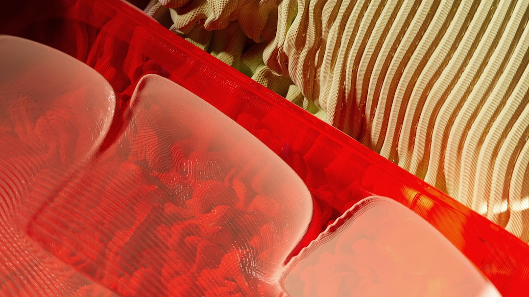 a close up of a red plastic container filled with food