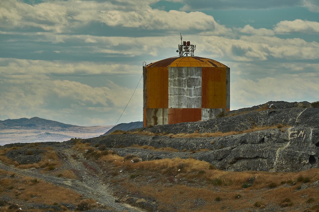 brown and gray tank near mountain