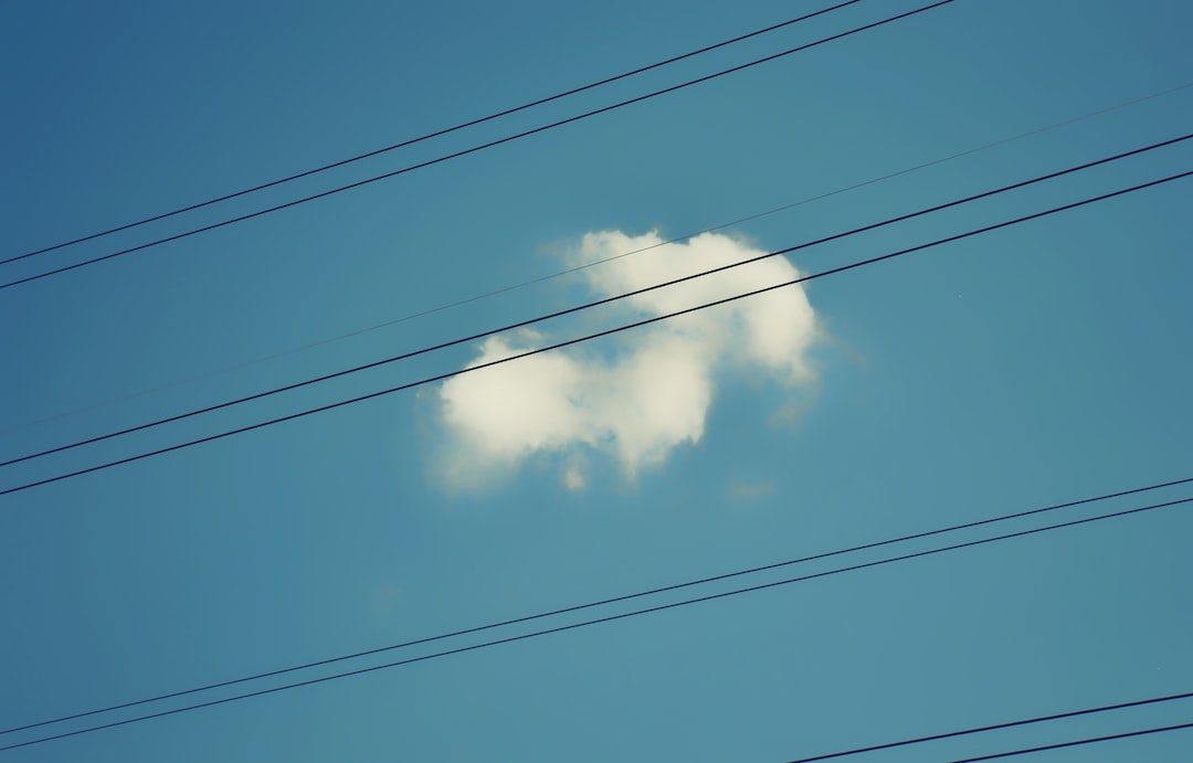 a cloud shaped like a heart on a blue sky