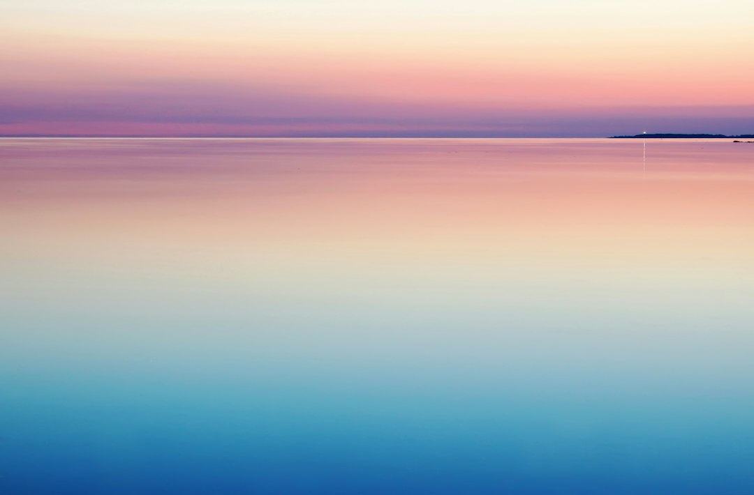 photo of blue and pink sea
