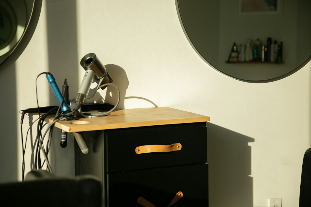 a hair dryer sitting on top of a wooden table