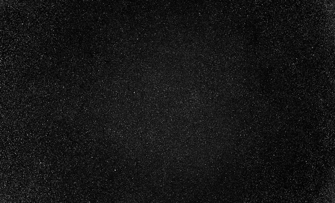 black textile on black background