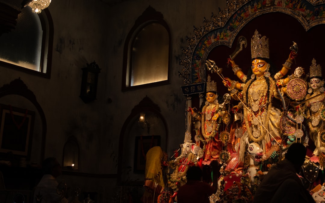 a statue of a person surrounded by other statues