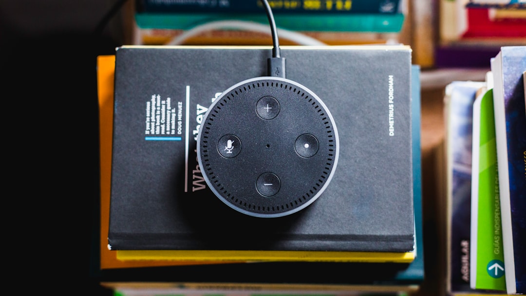 black Amazon Echo on black covered book