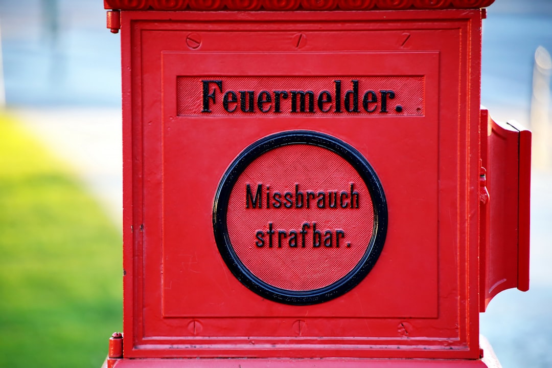 a red mailbox with a message written on it
