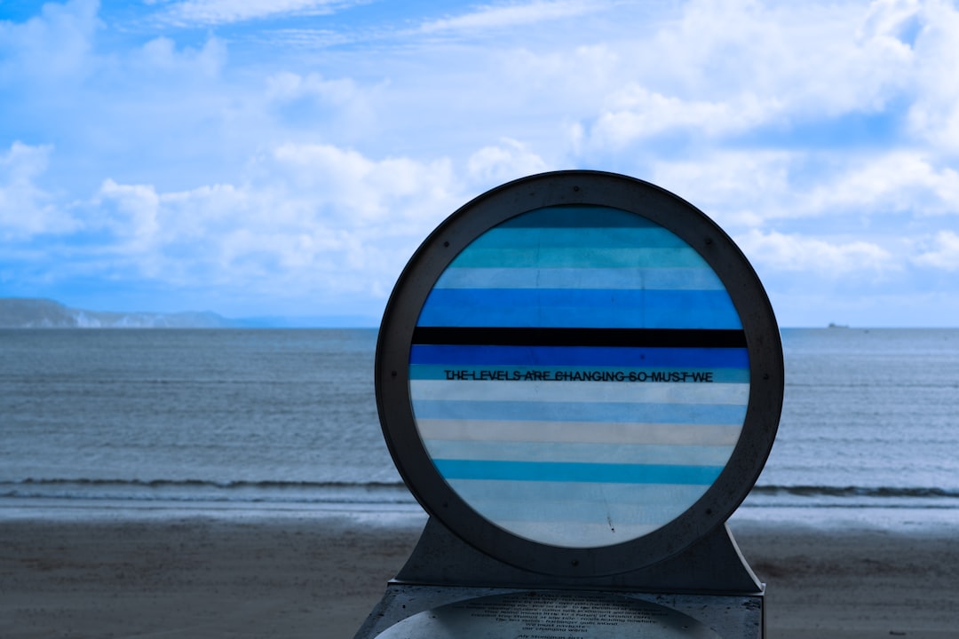 a glass object on a beach