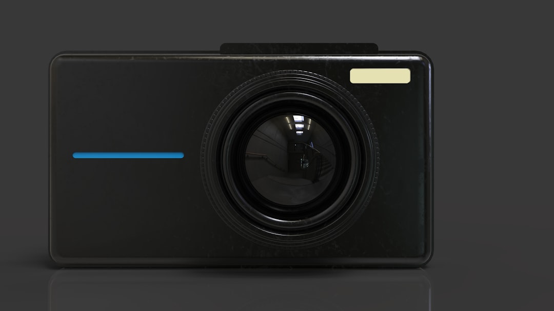 A black digital camera with a black background