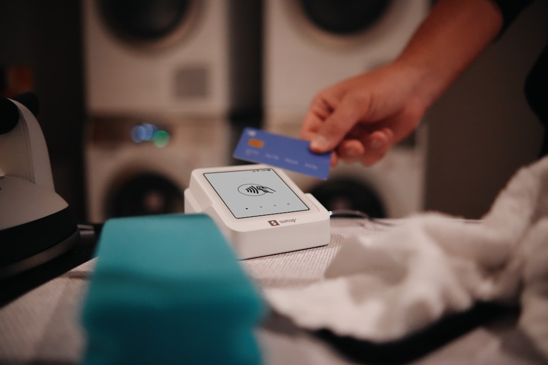 Paying with a card at the laundromat.