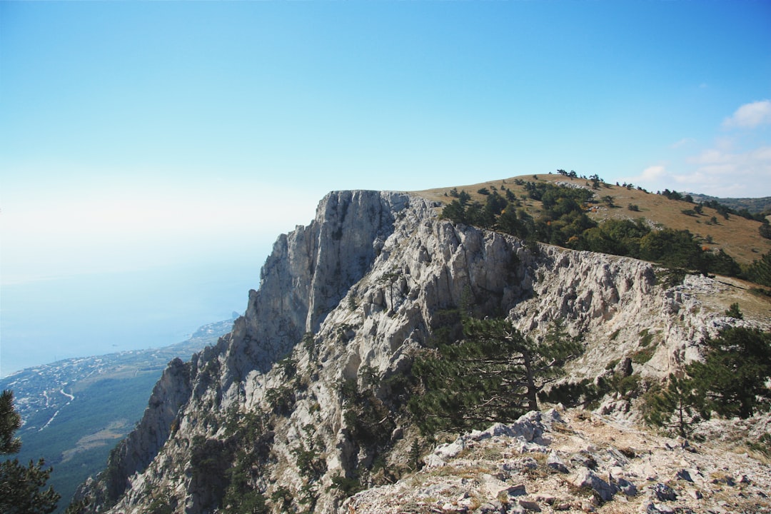 green and gray mountain under blue sky during daytime