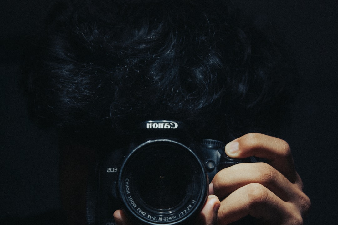a person holding a camera up to their face