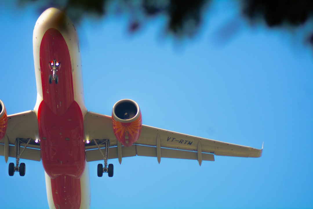 A large jetliner flying through a blue sky