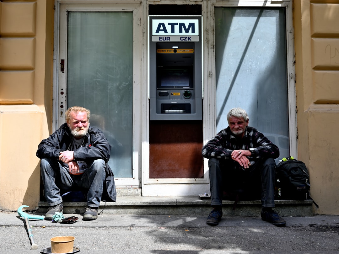 man in black jacket sitting beside man in black jacket