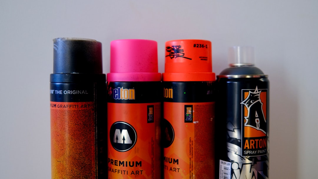 a group of different types of spray paint