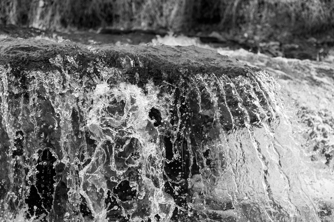 grayscale photo of water splash