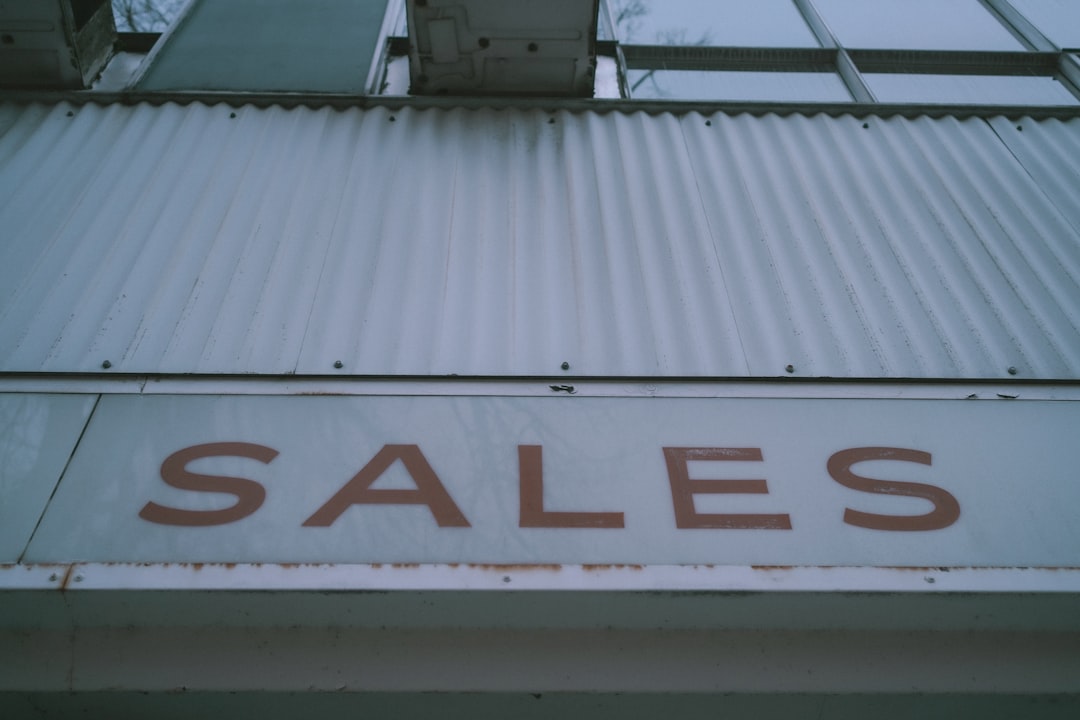 a sign that says sales on the side of a building