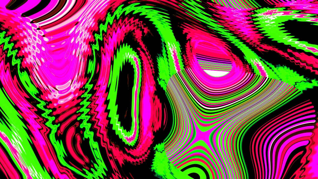 Abstract swirling pattern of pink and green colors.