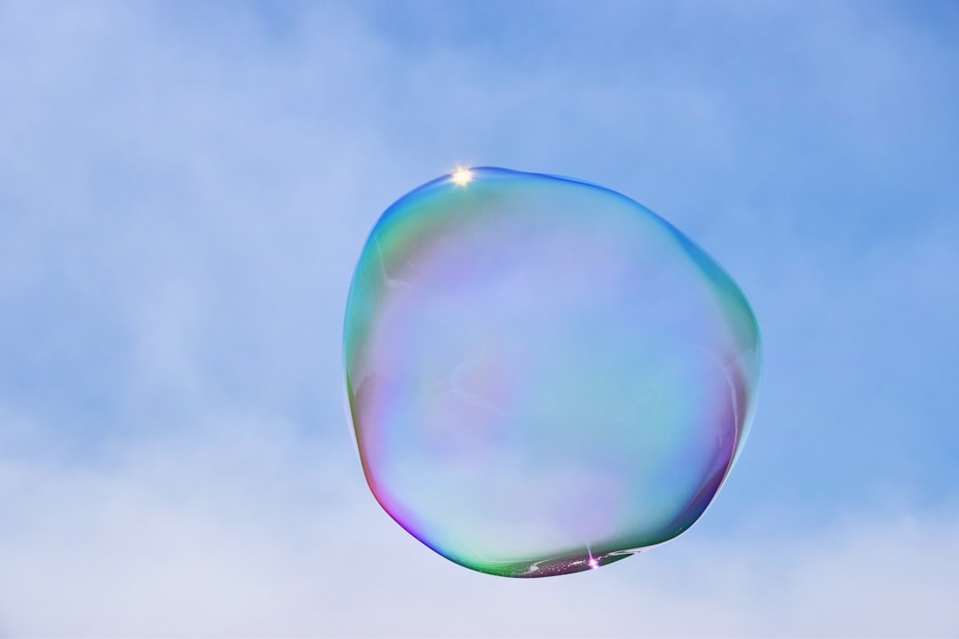 a blue balloon in the sky