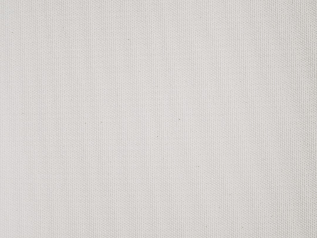 white textile with black line