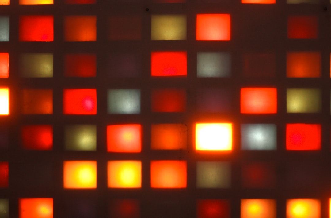 Glowing colorful squares create an interesting pattern.