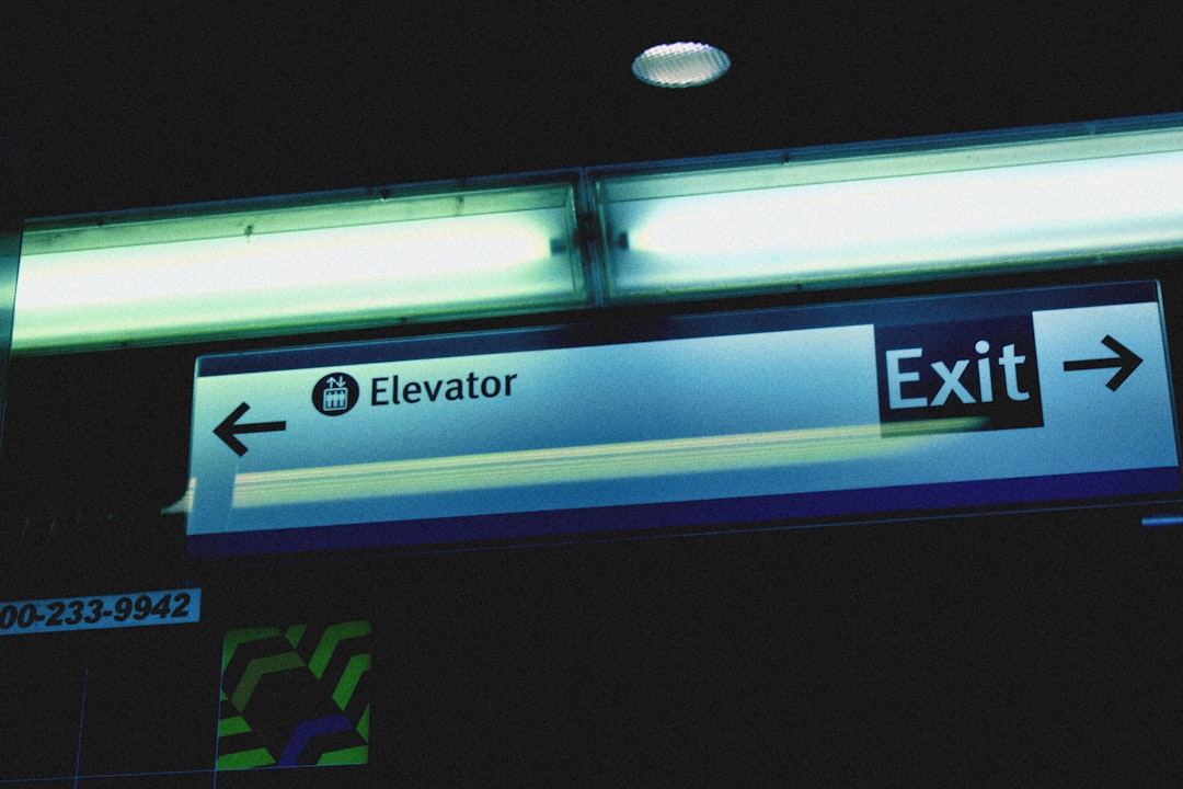 An exit sign is lit up at night